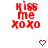 Red pixelated text 'KISS me XOXO' with a red heart symbol below, displayed on white background.
