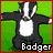 Pixelated cartoon badger with black-and-white stripes stands on green grass, next to red mushrooms and yellow snakes with 'SNAKE!!' text.
