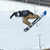 A pixelated figure in mid-air performing a snowboarding trick against a snowy background with blue text reading 'Shawn White' on the right.
