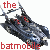 Pixelated dark blue vehicle with red accents and white highlights, surrounded by red text fragments on a white background.