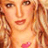 Pixelated close-up of a person with long light brown hair, visible facial features including eyes and lips, and a pink heart-shaped mark on the chest area.