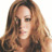 Static 48x48 pixel icon showing a close-up of a person with long wavy brown hair and light skin tone, rendered in low-resolution pixel art style with visible dithering.