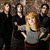 Six-person group photo with one person in gray shirt, another in blue dress, and others in dark clothing; red background with "funny-girl" text; white background with "paramore" text.