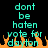 Pixelated cyan text on black background with orange flame-like shapes at bottom, displaying 'dont be haten vote for dayton' in two identical vertical
