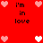 Red background with pixelated hearts and text reading 'i'm in love' arranged in a pattern