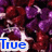 A pixelated image shows a character with purple hair and red clothing, holding a pink '<3' symbol against a dark background.