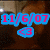 A pixelated image with four text elements in blue, pink, and green over a blurred background of two people.