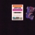 A static pixelated image shows a vertical rectangular frame with horizontal color bands on the left and a purple abstract shape on the right against a dark background.