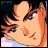 Pixelated anime-style character face with brown hair and light skin, next to stylized text on black background.