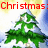 A pixelated Christmas tree with snow on branches, surrounded by red text reading "Christmas: The only day when we sit Around a dead tree Eating out of our socks" in four quadrants.
