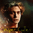 Pixelated portrait of a person with light brown curly hair against dark background, wearing yellow and black patterned clothing.