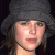 Pixelated image of a person with dark hair wearing a gray beanie, next to green text reading 'Original Icons .com' on a solid background.