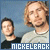 A contact sheet of three animated frames showing two men with text "NICKELBACK" at the bottom, displayed in a 2x2 grid layout with one empty cell.