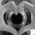 Black and white pixelated icon featuring a heart shape surrounded by curved lines resembling wings or motion trails.