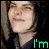 Animated contact sheet of a person with dark hair wearing a black hoodie, showing three sequential frames where text appears and changes across the bottom-left to top-right positions.