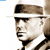 Static pixelated icon of a man's face wearing a wide-brimmed hat and dark sunglasses, rendered in sepia tones with visible dithering and low-resolution artifacts.
