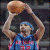 A basketball player in a blue jersey with red numbers holds a ball above his head while another player in yellow and blue defends, below text reading "I Love RIP".