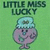 Green background with 'LITTLE MISS LUCKY' text above a pink character wearing a light blue hat, standing on two legs.
