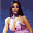 Pixelated static image of a woman with long dark hair wearing a white and pink bikini top against a blue background.