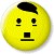 A static contact sheet showing two frames of a pixelated yellow emoji icon with black facial features and green text on a dark background.
