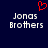 Dark blue background with two identical pixelated text blocks reading 'Jonas Brothers' and a red pixelated heart symbol above the left text block.