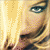 Pixelated close-up of a person's face with blonde hair and blue eyes, next to black text reading "GHV2 Nov 13" on white background.