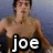 Pixelated image of a shirtless person with brown hair against a blue-gray background, featuring bold white text 'joe' at the bottom.
