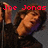 A four- shows a person with brown hair in dark clothing holding a microphone, with red text labels changing