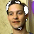 Pixelated close-up of a person with short dark hair, wearing a black choker with white symbols, against a light brown textured background.
