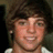 Pixelated image of a person with brown hair and light skin, accompanied by cyan text on black backgrounds reading "RYAN IS HOTT!!!" and "LOVE OF MY LIFE!!!"