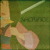 Pixelated static image shows a figure in yellow boots and orange pants standing on green grass with a white diagonal line above.