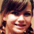 A pixelated image shows a person with brown hair and light skin on the left, next to a green heart-shaped graphic containing "Love you" text and a small black heart symbol.