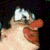 Animated sequence showing a character with red lips and white eyes in three distinct poses against dark, orange, and light backgrounds.
