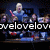 Group of people on a stage with one person holding red drumsticks, text overlay reading 'welove' in white letters.