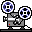 Pixelated film projector icon with two reels, blue and black circular patterns on reels, gray body, white stripe, red square detail, static image.