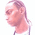 Pixelated profile view of a person with short hair, light skin tone, and a neutral expression against a white background.