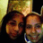 Two pixelated faces with warm brown and orange tones, one with dark hair, against a blurred background with yellow and brown hues.