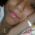A pixelated close-up of a person's face with closed eyes, pink lips, and light brown hair against a blurred background.