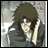 Pixelated anime-style character with dark hair and a gray jacket, hand near face, next to black background with white text.