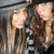 A pixelated image of two people with long brown hair wearing dark clothing and hats, with "J&K" text overlay.