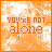 orange and white pixelated icons displaying the phrase "YOU'RE NOT alone" with varying opacity levels