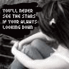 Black-and-white image of a person with long dark hair looking down, overlaid with pixelated text reading "YOU'LL NEVER SEE THE STARS IF YOUR ALWAYS LOOKING DOWN".