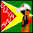 Pixel art icon of a cartoon character with brown skin wearing a white cap and black outfit, standing next to a large red and yellow triangular shape on a green background.