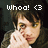 Pixelated image of a person with dark hair and light skin, wearing glasses, holding up two fingers near their face under text reading 'whoo! <3'.