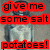 Pixelated image with red text boxes containing 'give me some salt potatoes!' over a blurred background of a person holding a container.