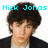 Pixelated image of a person with dark curly hair wearing a black jacket over white shirt, text above reads 'Nick Jonas is bringin' sexy back!' in cyan.