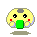Pixelated yellow circular character with gray top spot, black eyes, red cheeks, green mouth, and light blue hands holding green object against gray background.