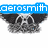 Blue text 'aerosmith' above two identical cartoon skulls with large ears and wide eyes, positioned side-by-side on a white background.