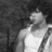 Black-and-white animated icon shows two identical figures in tank tops with shoulder straps, standing side-by-side against a dark background.