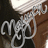Pixelated static image showing stylized text 'CJ' in white with black outlines against a dark background with brown and white elements.